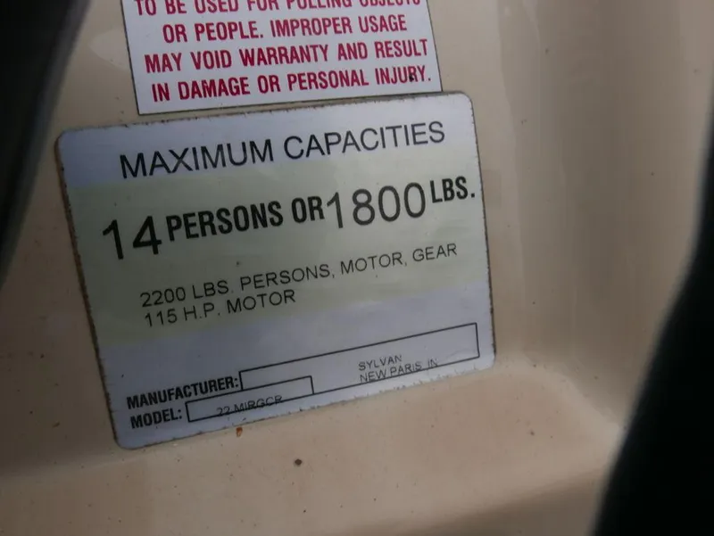 Slide: The Image of Maximum capacities label on a 2003 Sylvan 822 Mirage Cruise boat. - 10