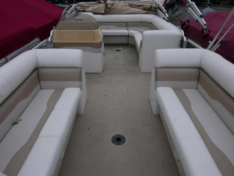 Slide: The Image of 2003 Sylvan 822 Mirage Cruise boat interior with beige and white seating. - 3