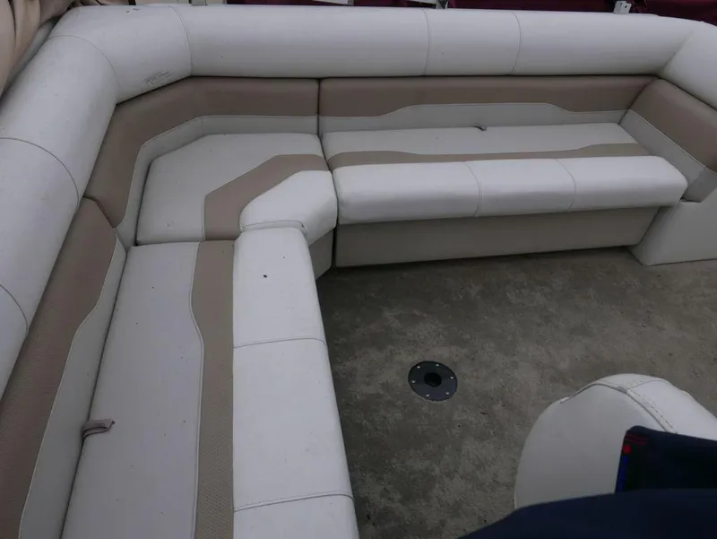 Slide: The Image of 2003 Sylvan 822 Mirage Cruise boat interior seating area. - 6