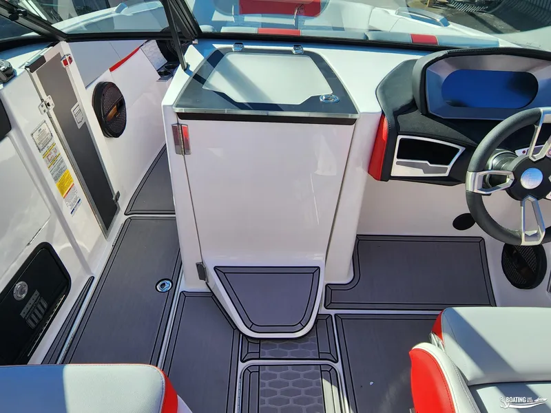 Slide: The Image of 2023 MasterCraft X26 boat interior with modern dashboard and seating. - 14