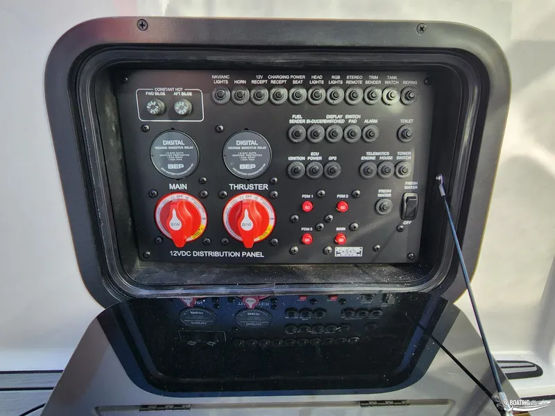 Slide: The Image of 2023 MasterCraft X26 12VDC distribution panel with switches and controls. - 16
