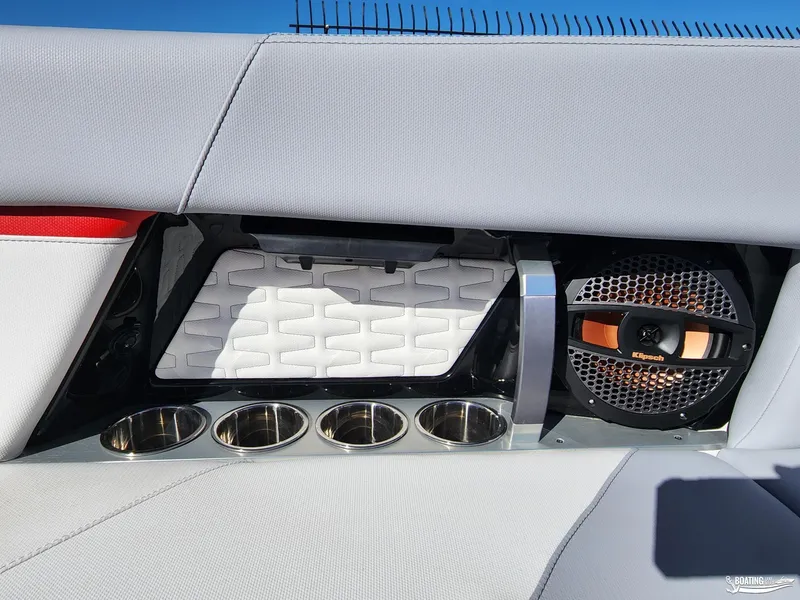 Slide: The Image of 2023 MasterCraft X26 interior with speaker and cup holders. - 20