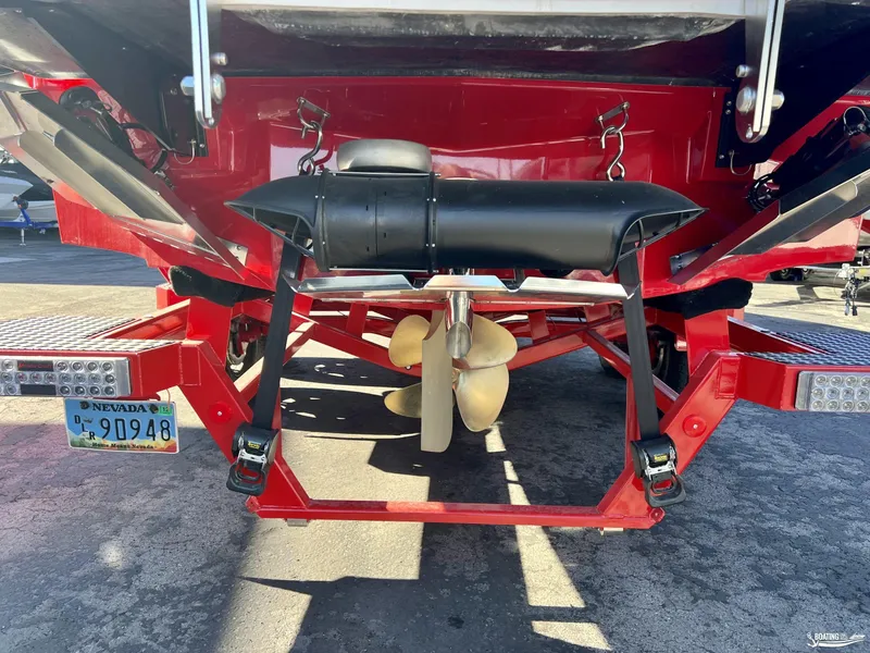 Slide: The Image of Rear view of 2023 MasterCraft X24 boat with propeller and Nevada license plate. - 2
