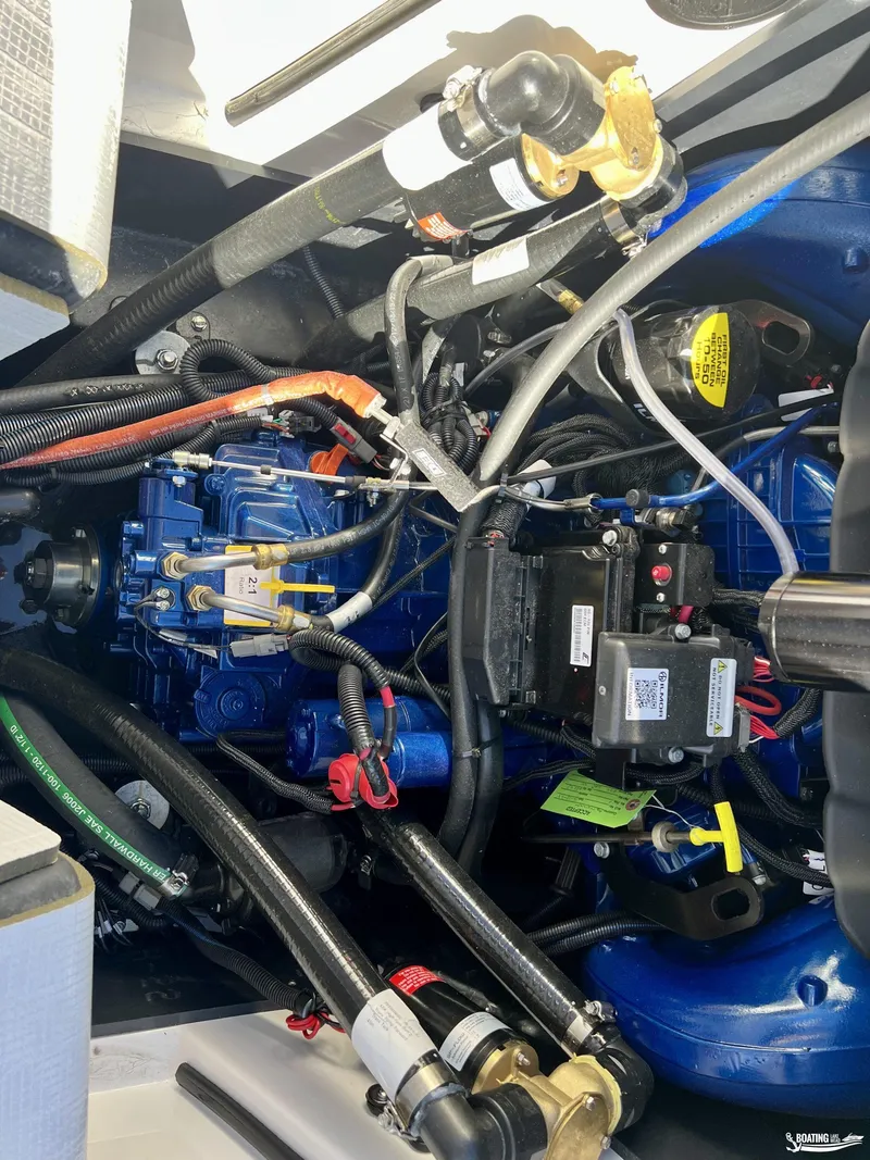 Slide: The Image of 2023 MasterCraft X24 engine compartment with detailed wiring and components. - 8