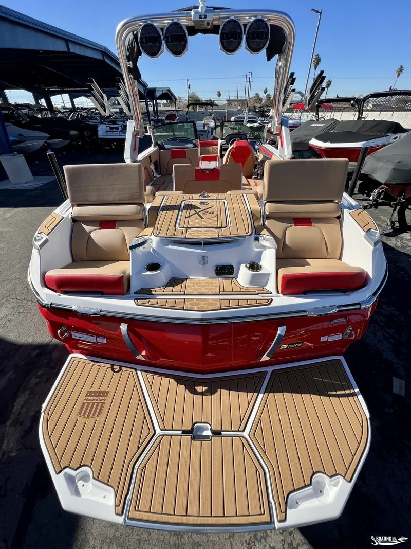 Slide: The Image of 2023 MasterCraft X24 boat with luxurious seating and sleek design. - 9