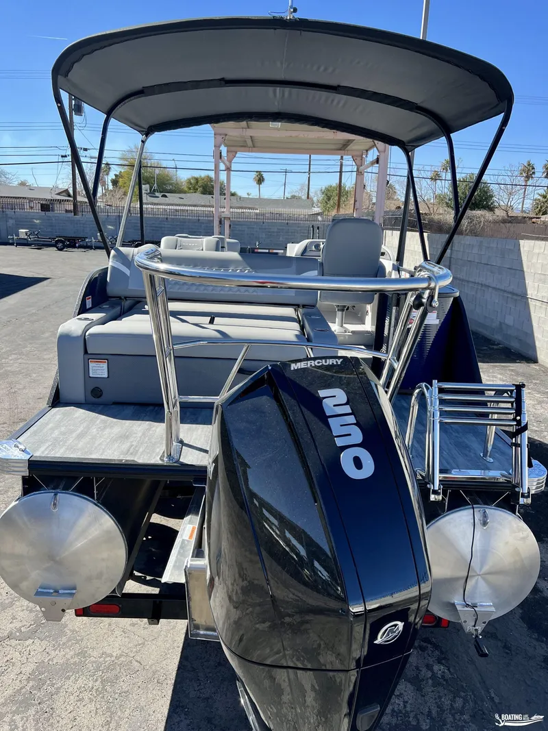 Slide: The Image of 2023 Crest Classic Platinum 220 SLS pontoon boat with Mercury 250 engine. - 2