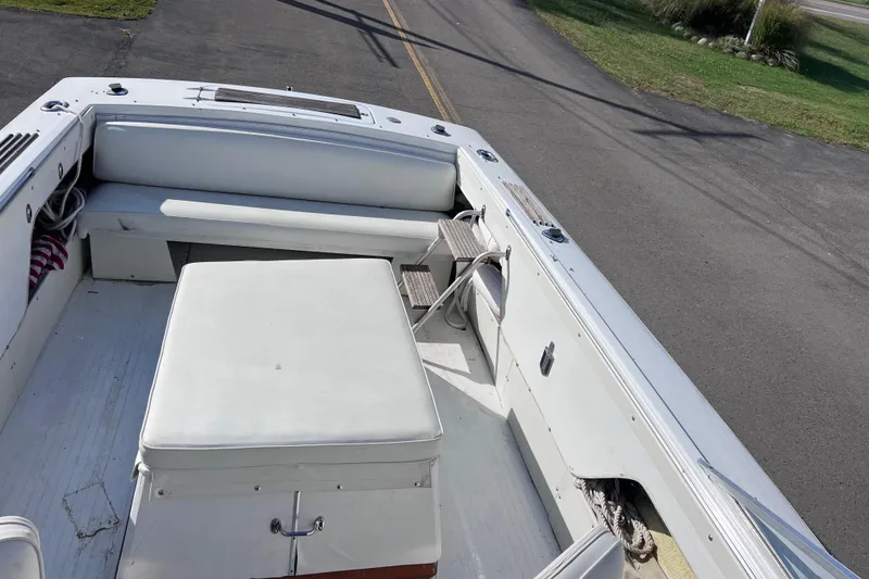 Slide: The Image of 1972 Chris-Craft Launch 23 boat interior with white seating and storage compartments. - 17