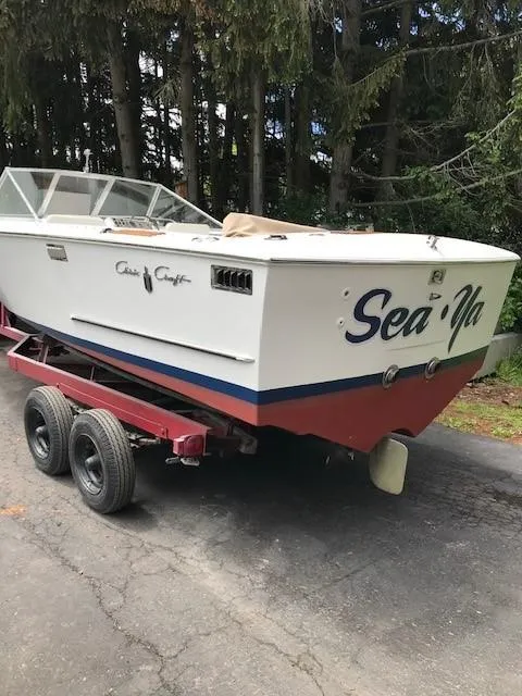 Slide: The Image of 1972 Chris-Craft Lancer boat named Sea-Ya on a red trailer. - 5