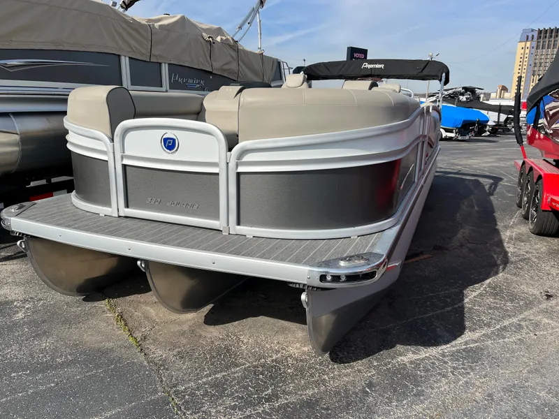 Slide: The Image of 2022 Premier 250 Solaris RF pontoon boat in a marina. - 12