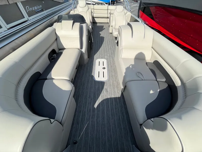 Slide: The Image of 2022 Premier 250 Solaris RF pontoon boat with spacious seating and modern interior design. - 15