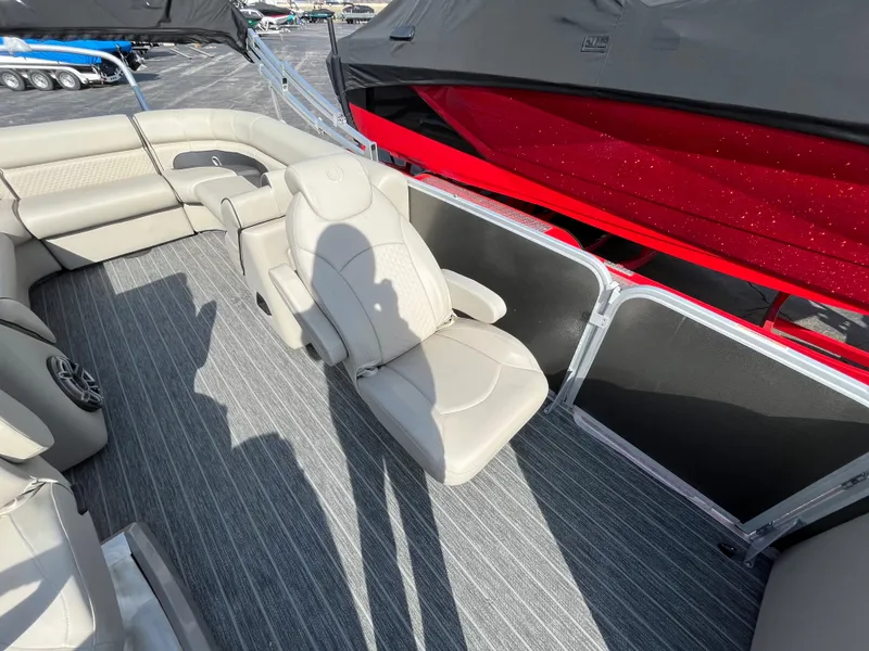 Slide: The Image of 2022 Premier 250 Solaris RF boat interior with beige seating and striped flooring. - 17