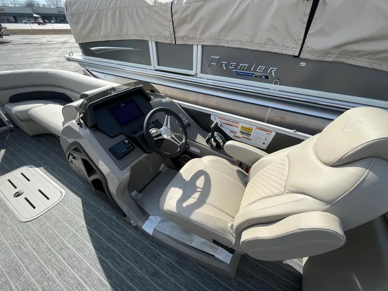 Slide: The Image of 2022 Premier 250 Solaris RF boat interior with helm and seating area. - 19