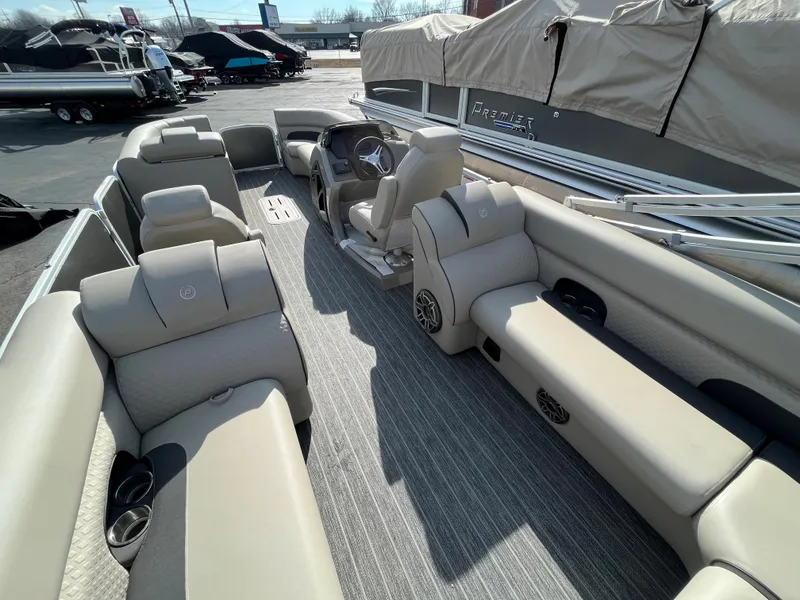 Slide: The Image of 2022 Premier 250 Solaris RF pontoon boat with spacious seating and modern design. - 22