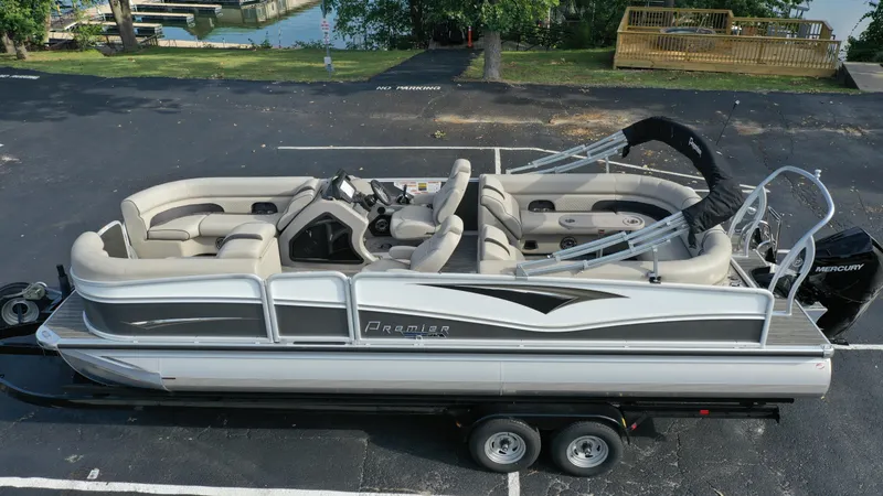 Slide: The Image of 2022 Premier 250 Solaris RF pontoon boat on trailer, top view. - 8