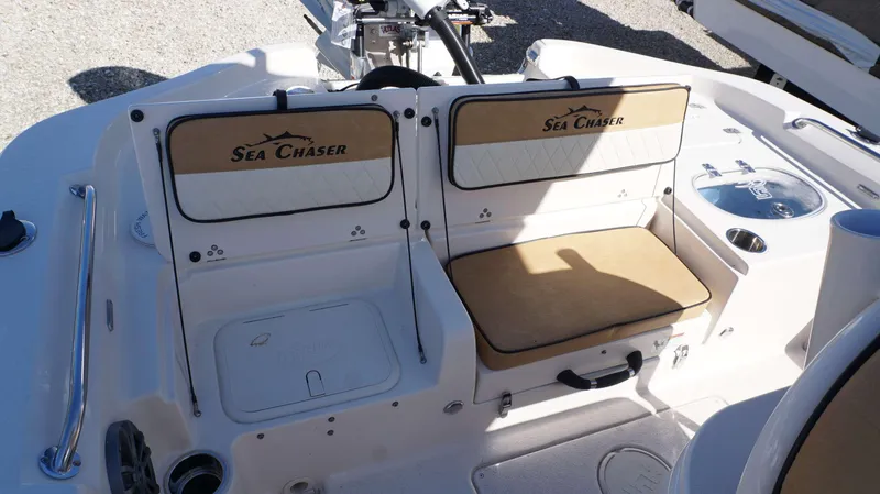 Slide: The Image of 2023 Sea Chaser 23 LX boat interior seating and storage compartments. - 10