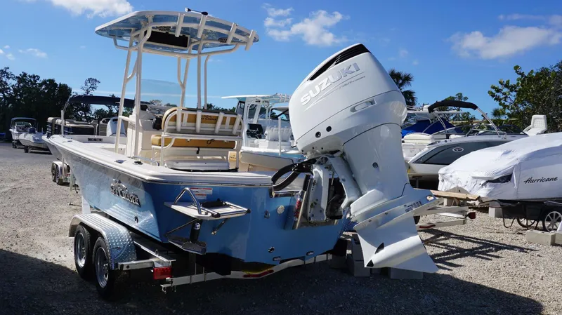 Slide: The Image of 2023 Sea Chaser 23 LX boat with Suzuki outboard motor on trailer. - 12
