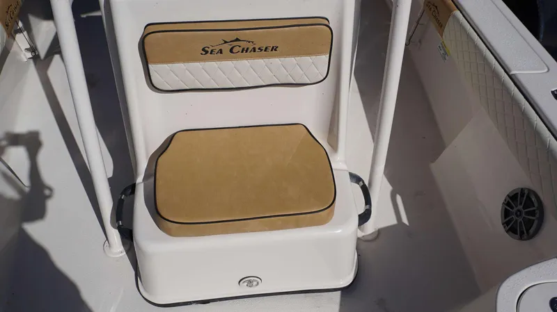 Slide: The Image of 2023 Sea Chaser 23 LX boat seat with tan and white cushioned upholstery. - 17