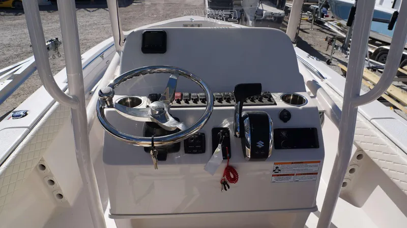 Slide: The Image of 2023 Sea Chaser 23 LX boat console with steering wheel and controls. - 3