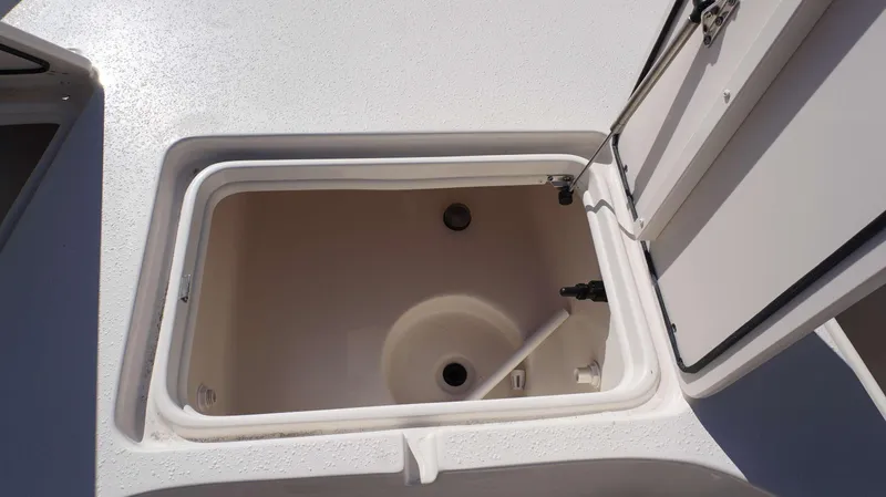 Slide: The Image of Open storage compartment on a 2023 Sea Chaser 23 LX boat. - 6