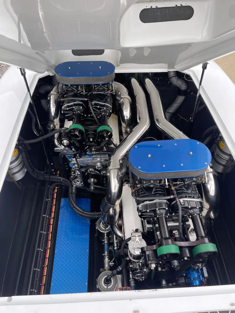 Slide: The Image of 2003 Outerlimits 47 GTX engine compartment with dual high-performance engines. - 30