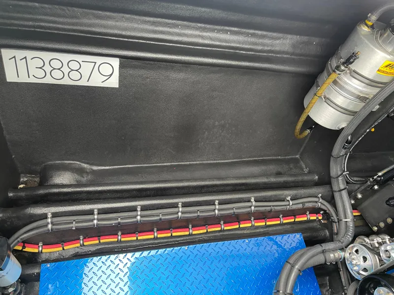 Slide: The Image of Engine compartment of 2003 Outerlimits 47 GTX with visible wiring and components. - 32