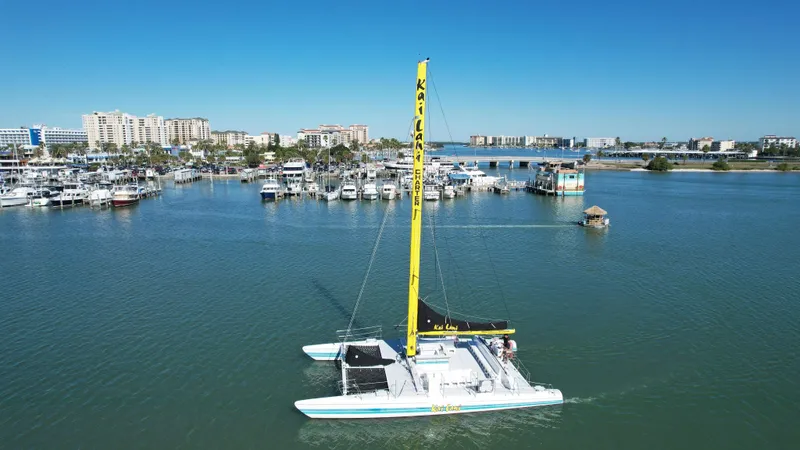 Slide: The Image of Aerial view of a 1992 Robertson Custom Catamaran Sloop Rig in a marina. - 10