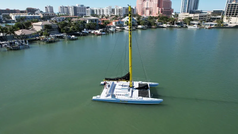 Slide: The Image of Aerial view of a 1992 Robertson Custom Catamaran Sloop Rig in a marina. - 16