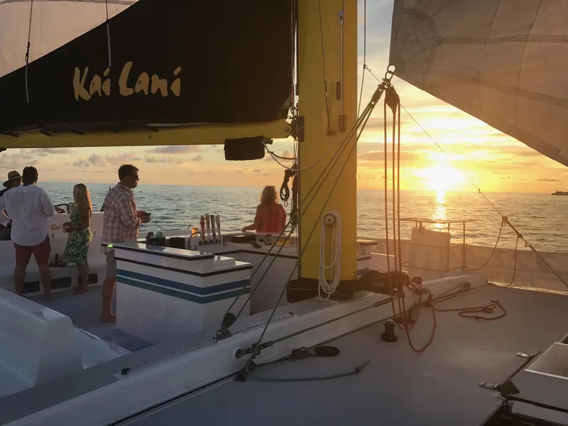 Slide: The Image of People enjoying sunset on a 1992 Robertson Custom Catamaran Sloop Rig named Kai Lani. - 3