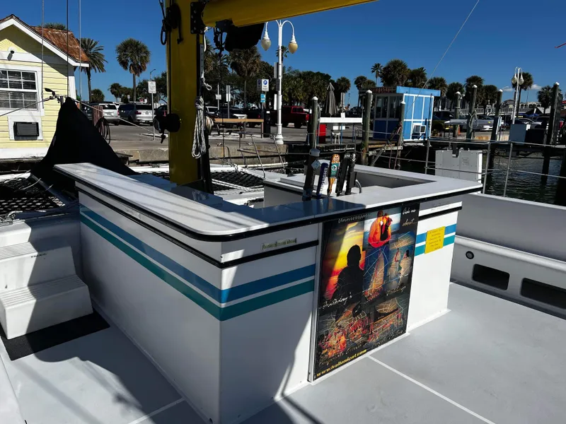 Slide: The Image of Outdoor bar area on a 1992 Robertson Custom Catamaran Sloop Rig at a marina. - 36
