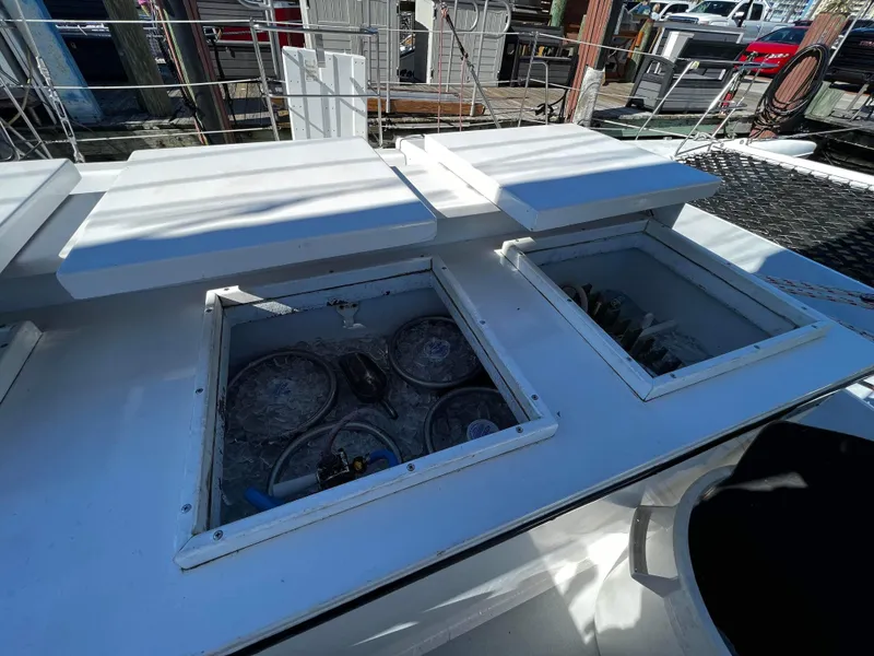 Slide: The Image of Open storage compartments on a 1992 Robertson Custom Catamaran Sloop Rig. - 40