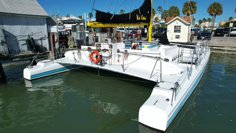 Slide: The Image of 1992 Robertson Custom Catamaran Sloop Rig docked at marina. - 8