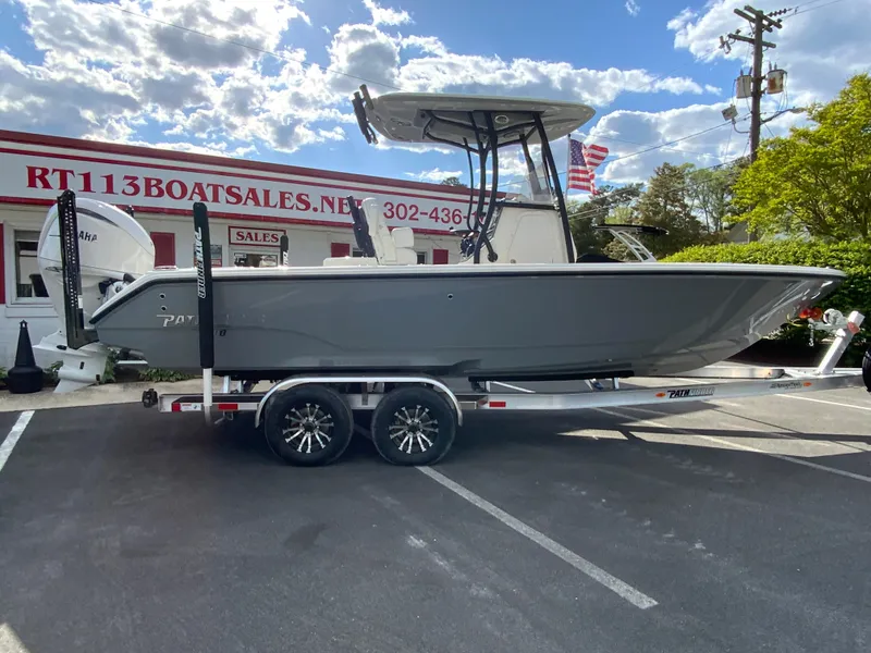 Slide: The Image of 2024 Pathfinder 2400 Open boat on trailer at dealership. - 0