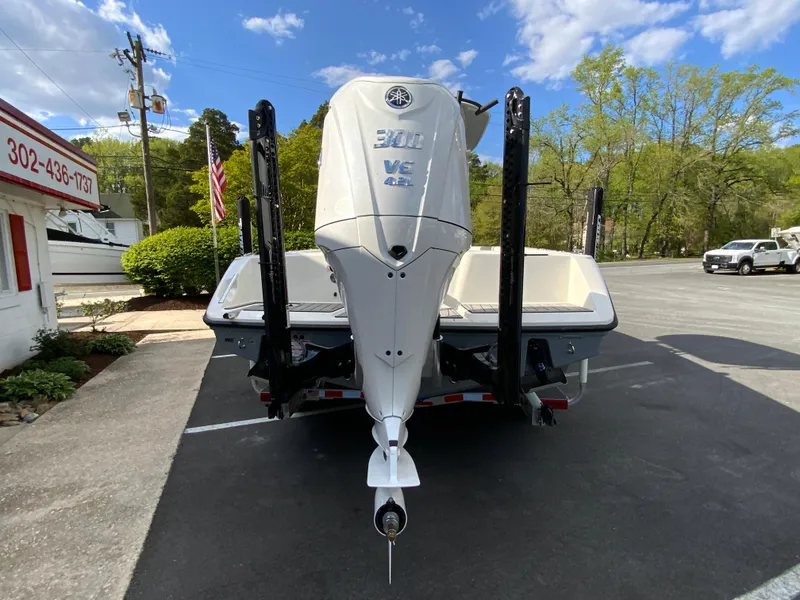 Slide: The Image of 2024 Pathfinder 2400 Open boat with Yamaha engine, rear view in parking lot. - 10