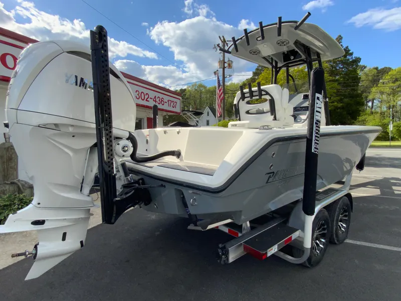 Slide: The Image of 2024 Pathfinder 2400 Open boat on trailer, rear view, outdoor setting. - 11