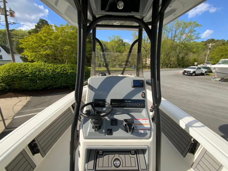 Slide: The Image of 2024 Pathfinder 2400 Open boat console with steering wheel and controls. - 16