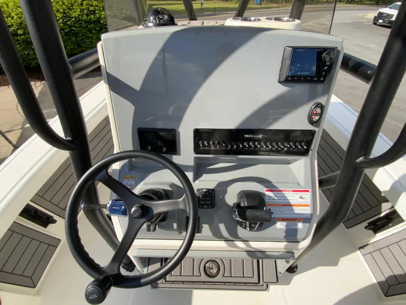 Slide: The Image of 2024 Pathfinder 2400 Open boat console with steering wheel and controls. - 17