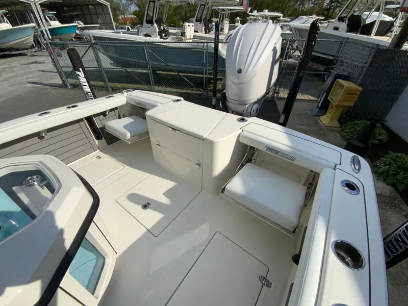 Slide: The Image of 2024 Pathfinder 2400 Open boat interior with seating and storage compartments. - 19