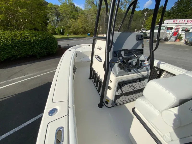 Slide: The Image of 2024 Pathfinder 2400 Open boat interior with steering console and seating. - 22