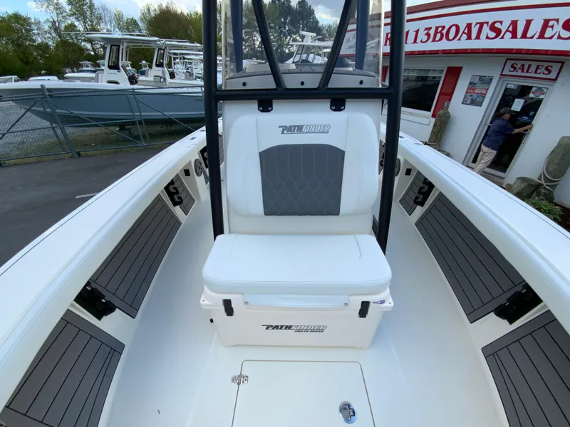 Slide: The Image of 2024 Pathfinder 2400 Open boat interior at a dealership. - 29