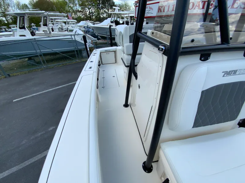 Slide: The Image of 2024 Pathfinder 2400 Open boat interior view at a marina. - 30