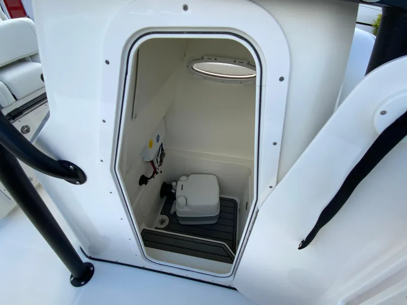 Slide: The Image of 2024 Pathfinder 2400 Open boat interior with compact toilet. - 31
