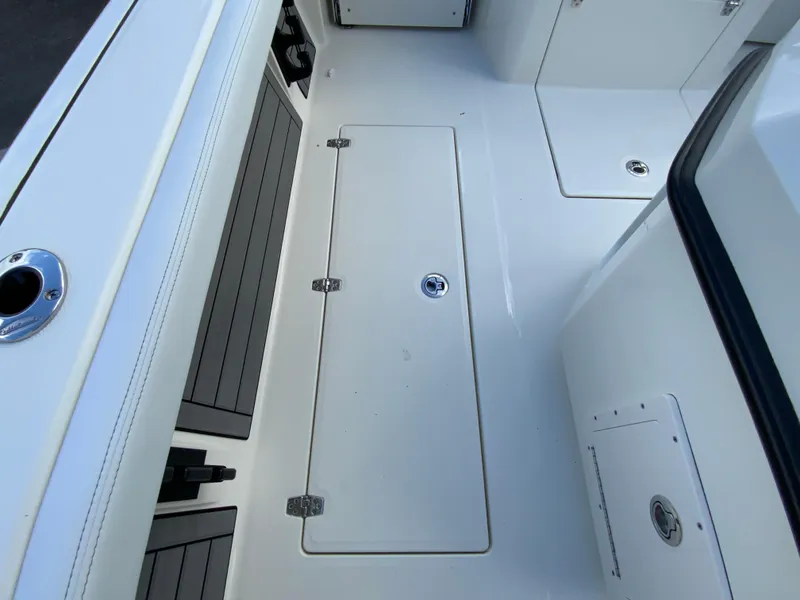 Slide: The Image of 2024 Pathfinder 2400 Open boat deck with storage compartments. - 33
