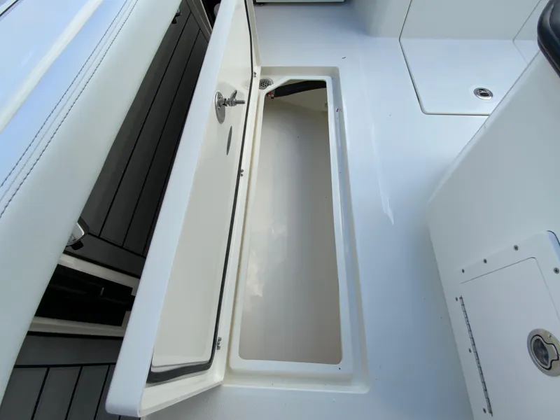 Slide: The Image of 2024 Pathfinder 2400 Open boat storage compartment with open hatch. - 34