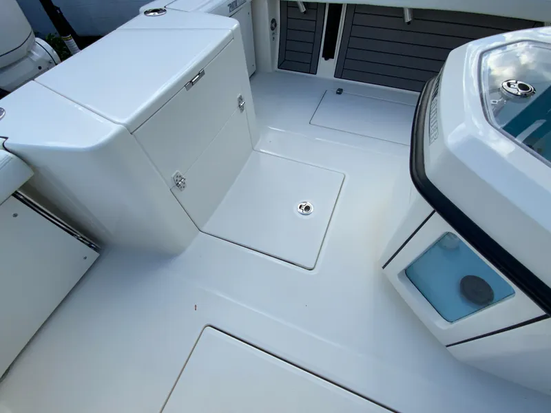 Slide: The Image of 2024 Pathfinder 2400 Open boat deck with storage compartments and livewell. - 35