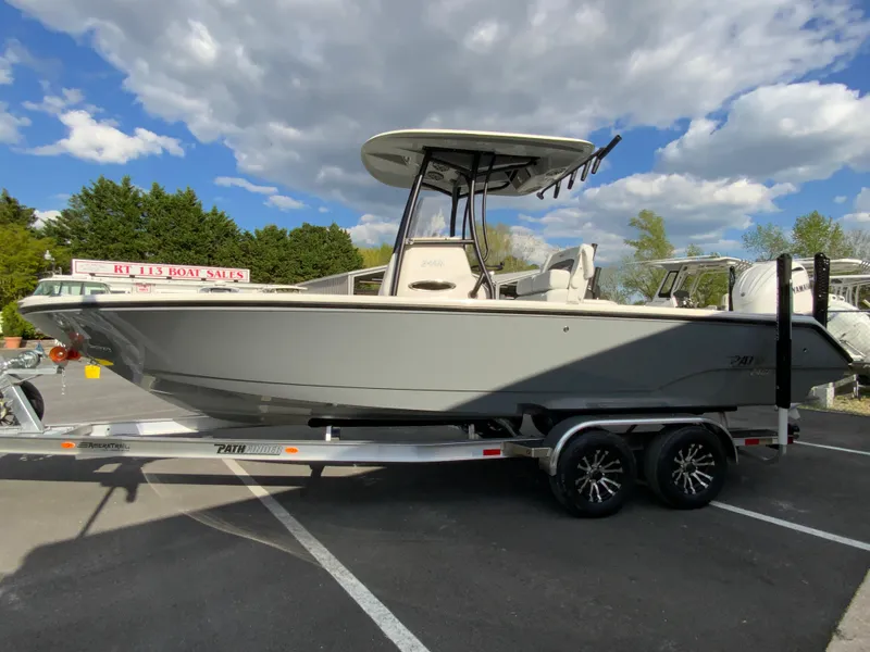 Slide: The Image of 2024 Pathfinder 2400 Open boat on trailer under cloudy sky. - 7