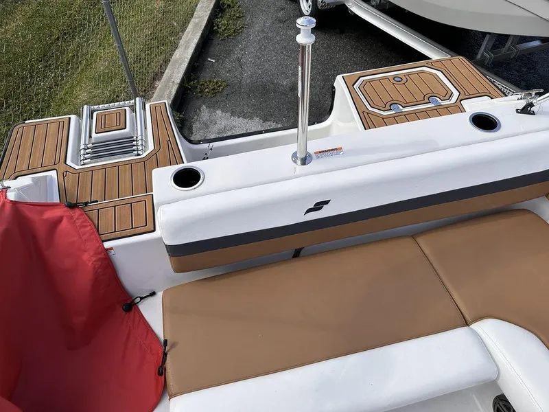 Slide: The Image of 2023 Starcraft SVX OB 191 OB boat interior with tan and white seating. - 11