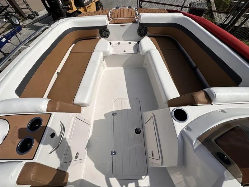 Slide: The Image of 2023 Starcraft SVX OB 191 OB boat interior with spacious seating and cup holders. - 13
