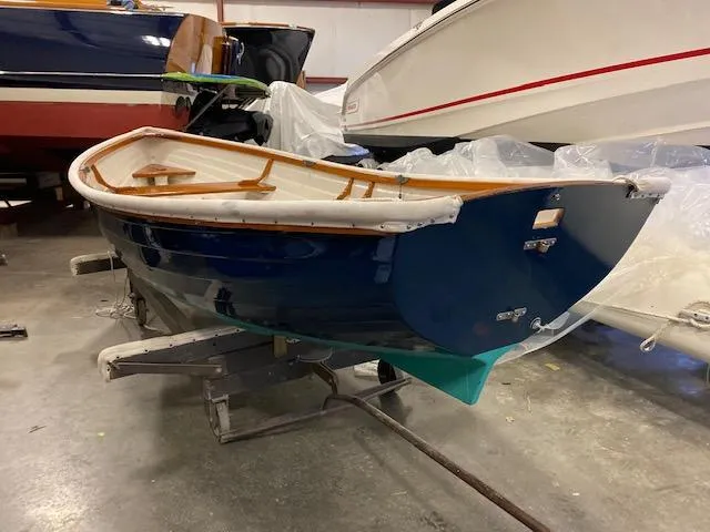 Slide: The Image of 1973 Stanley Herreshoff Yacht Tender in storage, showcasing classic design and craftsmanship. - 1