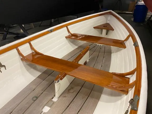 Slide: The Image of 1973 Stanley Herreshoff Yacht Tender with wooden seats and white interior. - 8