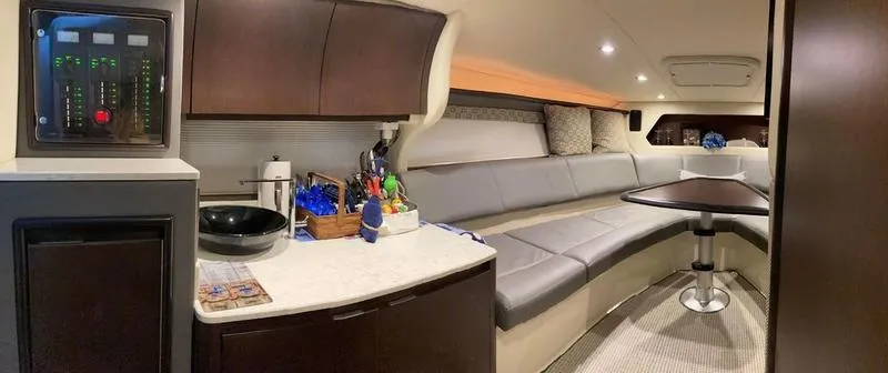 Slide: The Image of Interior of 2018 Cobalt A40 Coupe with modern kitchen and cozy seating area. - 13